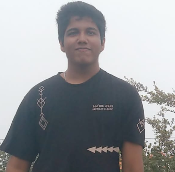 A photo of me on a windy day on a hill, probably clicked sometime in 2024